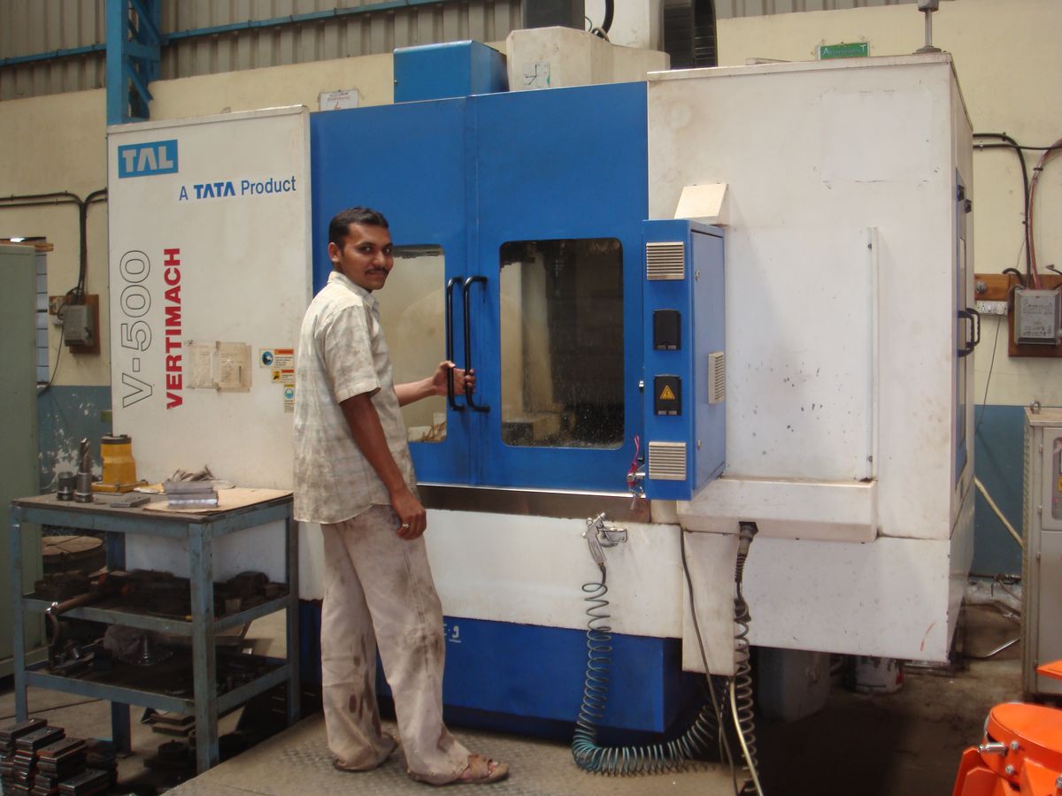 Machine operator running a CNC machining centre