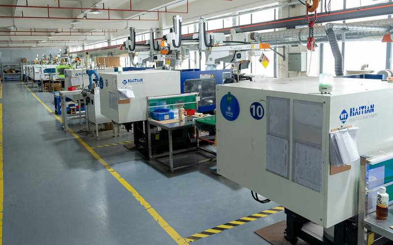Row of CNC machining centres in production